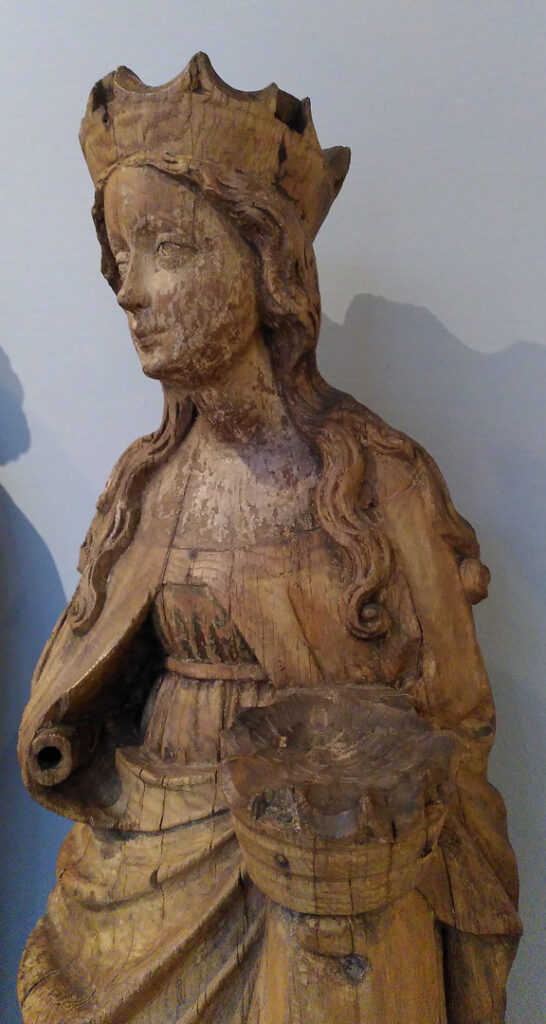 A photo of a wooden statue, cropped