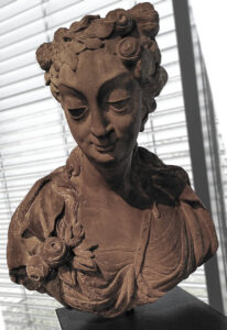A photo of a statue (bust) of a woman