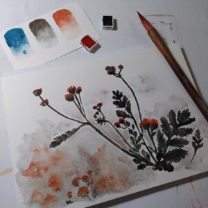 A photo of an unfinished watercolour painting of flowers, with painting supplies